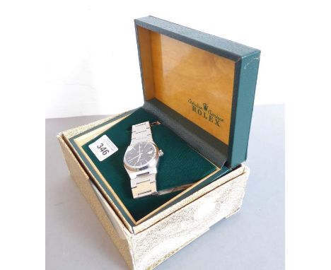 PLEASE NOTE NOT DAY/DATE - JUST DATE   A gentleman's steel-cased Rolex 'Datejust Oysterquartz' wristwatch; the signed black d