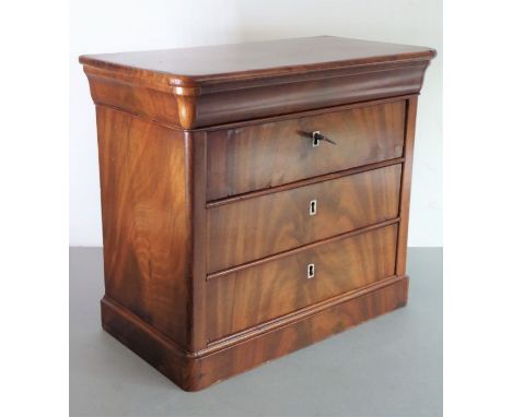 A 19th century&nbsp;miniature figured mahogany French commode; three full-width drawers with vertical rectangular bone escutc