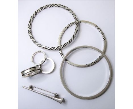 Six items of silver jewellery by Georg Jensen; a plain bangle numbered '51A'; a rope finish and plain woven bangle numbered '