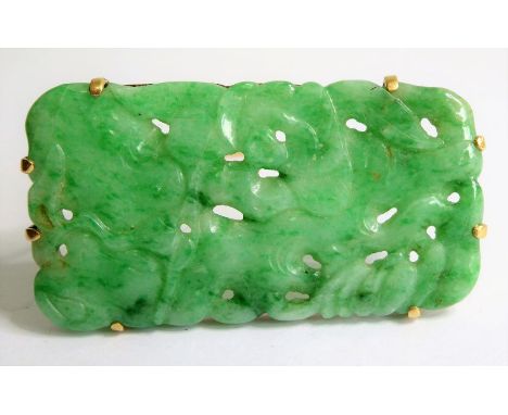 A rose-gold coloured brooch of rectangular form and mounted with an apple jade carving of flowers and leaves (length 52mm x 2