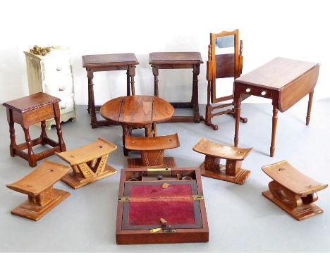 Thirteen pieces of miniature furniture:three 17th century style oak joint stoolsa set of five miniature African-style headres