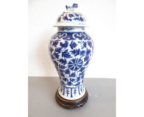 A late 19th century Chinese blue-and-white vase of baluster form; decorated with leaves and chrysanthemum heads above Ming-st