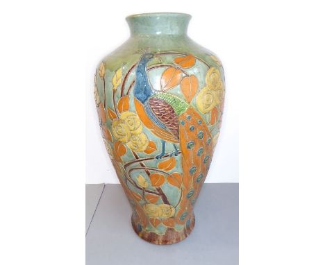 A large late 19th / early 20th century baluster-shaped pottery vase in the style of C.H. Brannam: the main body hand-decorate