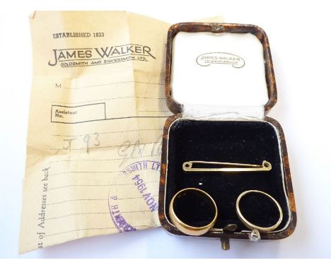 A 22-carat yellow gold wedding band, size K½/L (5.5g), together with a brilliant-cut single stone ring coronet-set above to t