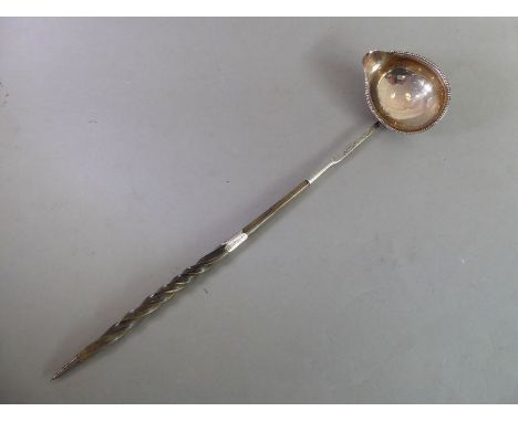 A George III silver-mounted toddy ladle with twisted whalebone handle; with gadrooned bowl and interior hallmarks (rubbed), t