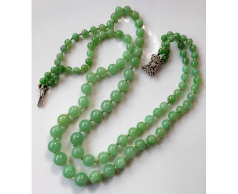 A two row graduated jadeite necklace, the spherical jadeite beads measuring approx. 5.0mm-9.0mm to the shaped rectangular ope