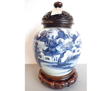 An 18th/19th century blue and white porcelain jar decorated with a lone boatman on water before buildings and rockwork etc., 