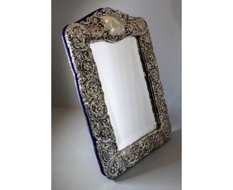 A large and modern hallmarked, filled, silver framed dressing table easel mirror in 19th century style; central top vacant ca