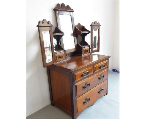An unusual miniature Edwardian period walnut dressing table; central swing-mirror flanked by two supports with small drawers,