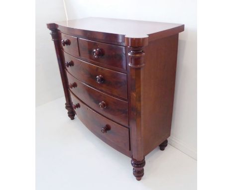 A large mid-19th century Scotch-style mahogany chest; two half-width over three full-width graduated bow-fronted drawers with