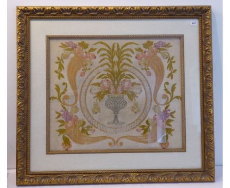 An antique hand-embroidered tapestry depicting a pear tree and roses emanating from a central neoclassical-style vase and fla
