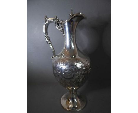 A fine 19th century hallmarked silver claret / wine jug of neoclassical inspiration: the hinged shaped cover lifting to revea