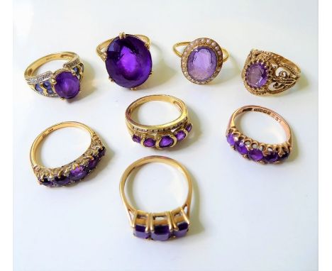 Eight amethyst set and 9-carat yellow gold rings, three with diamond-set detail and one with a half pearl cluster surround, 2