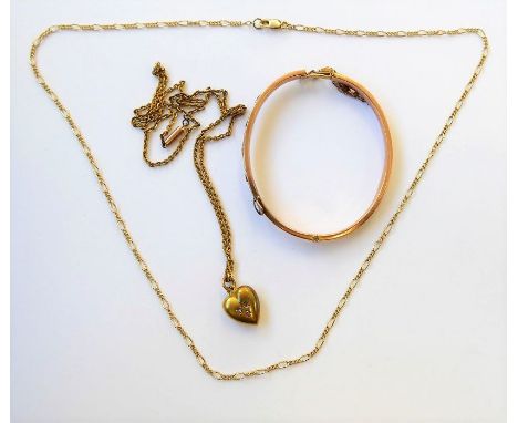 A 15-carat yellow gold heart-shaped pendant with rose-cut diamond-set detail (a/f) to the oval link chain, the barrel clasp s