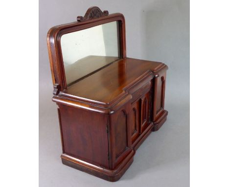 A miniature mirror-backed pedestal sideboard in mid-19th century style;&nbsp;the mirror frame surmounted with a half floral c