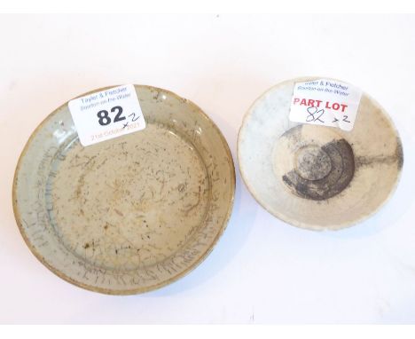 Yuan / Ming dynasty - two small, circular ceramic dishes. The larger with a mottled grey glaze (9.5cm diameter) and the small