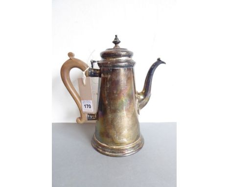 A hallmarked silver coffee pot in 18th century design; the finial above a carved wooden handle and conical body, raised on sl
