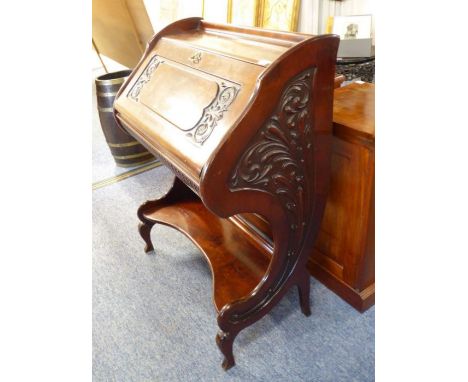 A highly stylised late 19th / early 20th century mahogany writing bureau of Art Nouveau form and inspiration; three-quarter g