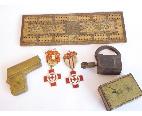 An assortment of items to include a British Red Cross Society Proficiency medal (1916-17) TO4011 Esther Barker; a Red Cross N