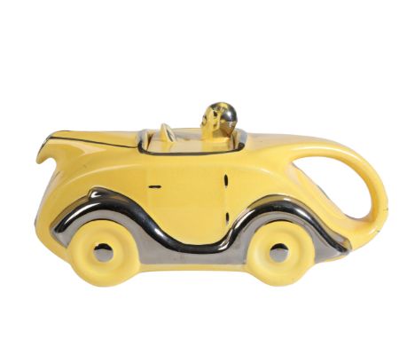 A YELLOW SADLER 'OKT42' MOTORCAR TEAPOT with chrome wings, 22cm long