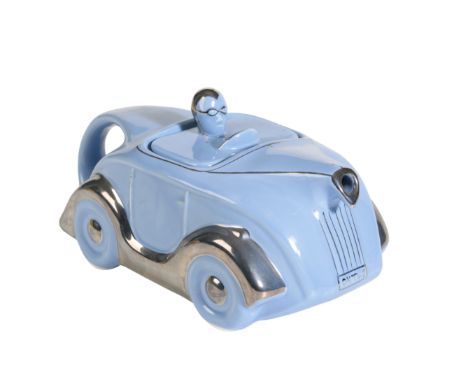 A LIGHT BLUE MOTORCAR BY RACING TEAPOTS with chrome wings, 23cm long