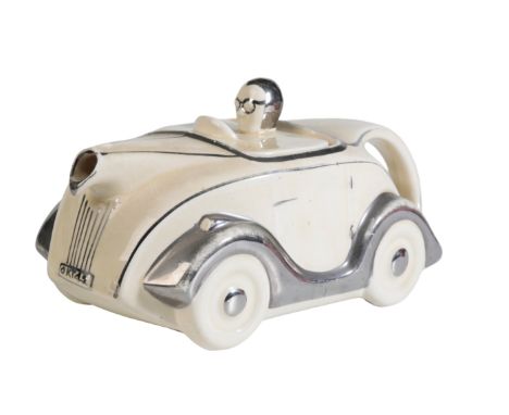 A CREAM SADLER 'OKT42' MOTORCAR TEAPOT with chrome wings, 22cm long