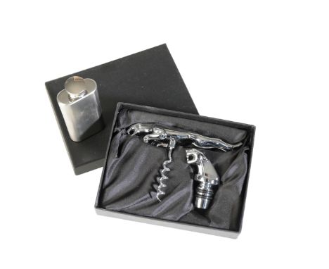 A JAGUAR PRESENTATION SET containing a chrome plated leaping cat corkscrew, a Jaguar head bottle stopper and a stainless stee