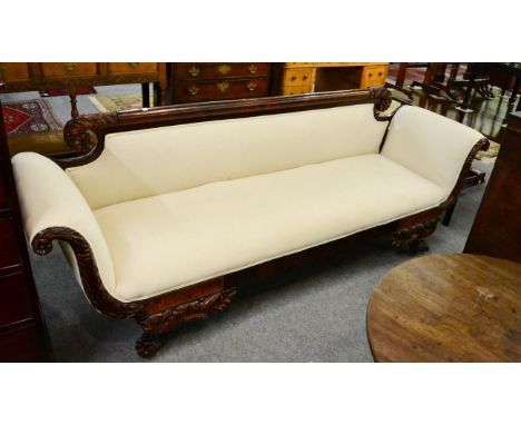 A 19th Century carved mahogany claw feet sofa 