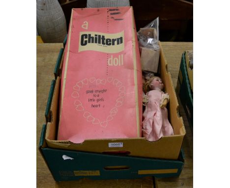 An Armand Marseille bisque headed doll (a.f.) with a boxed Chiltern doll and another, with accessories (qty) 