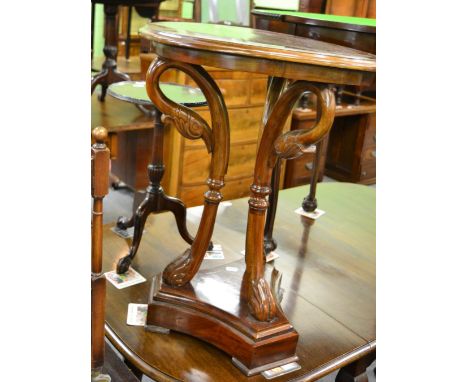 A reproduction swan neck table and a mahogany tripod table