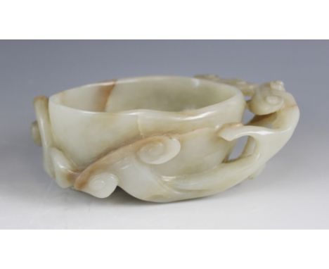 A Chinese jade Lingzhi bowl/brush washer, 19th century, of oval form and carved with lingzhi vines, 14cm wide (at fault)Condi