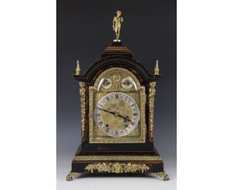 A late 19th century German bracket clock, movement stamped for Winterhalder & Hofmeier, the arched stained walnut case with e