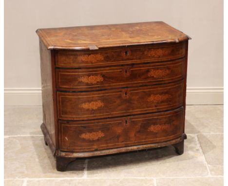 An early 18th century walnut and marquetry chest of drawers, the bow front moulded top inlaid with a floral spray flanked by 