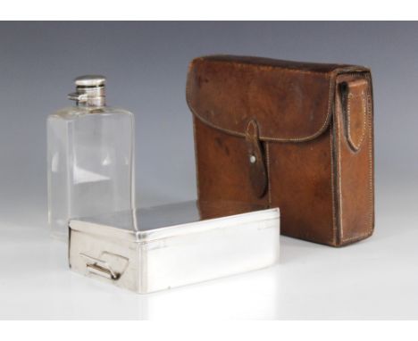 An early 20th century Champion & Wilton EPBM picnic set in leather holder, containing a sandwich tin and glass flask with bay