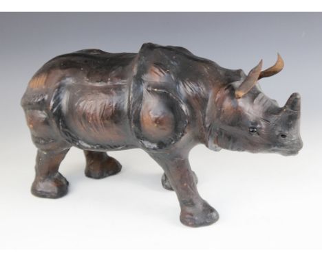 An Abercrombie & Fitch type leather model of a Rhinoceros, 20th century, 51cm longCondition reportVisible seam on Rhino horn,