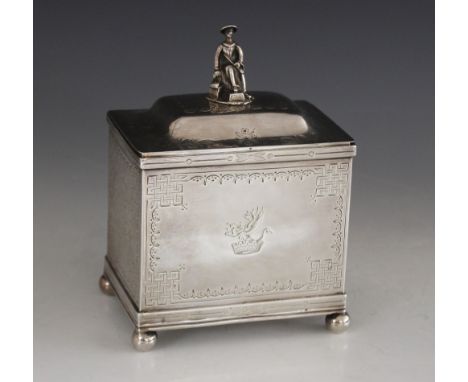 A Victorian silver tea caddy, Thomas Smily, London 1865, of rectangular form on four bun feet, hinged cover with cast finial 