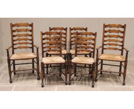 A set of six reproduction oak ladder back dining chairs, in the manner of Titchmarsh and Goodwin, late 20th century, each cha
