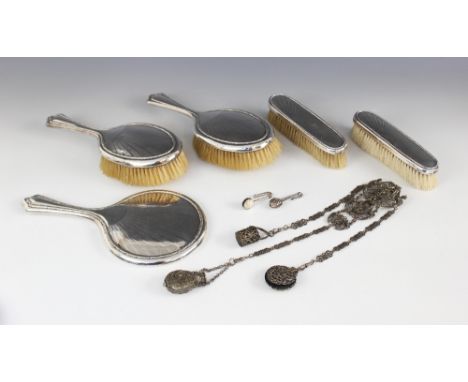 A George V five-piece silver mounted dressing table set,  Walker &amp; Hall, Sheffield 1922, comprising handheld mirror, two 