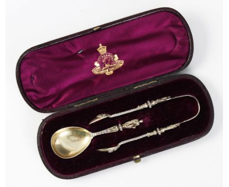 A Victorian silver christening set, William Edwards, London 1874, comprising caddy spoon and sugar nips, each with gilt bowls