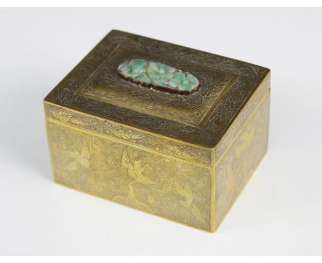 A Chinese Jade inset brass box and cover, 19th century, of hinged rectangular form, the cover inset with a floral jade carvin