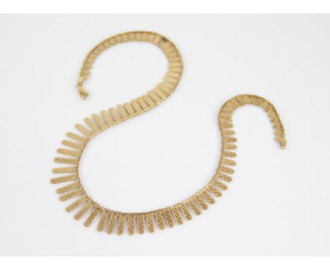A 9ct gold fringe necklace, the graduated links measuring between 4mm and 16mm, engine turned decoration, lobster claw and lo