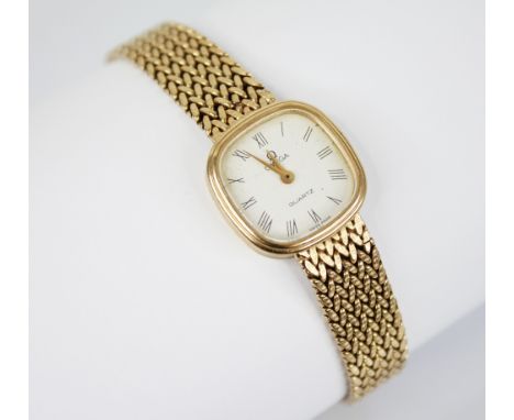 A ladies vintage 9ct gold Omega quartz wristwatch, the cushion shaped white dial with Roman numerals, set to a plain polished