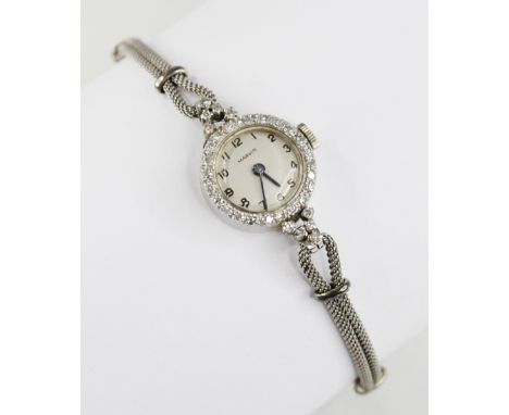 A ladies vintage Marvin platinum diamond set cocktail watch, circular dial with Arabic numerals, single cut diamonds set to b