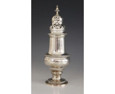 A Victorian silver sugar caster, Charles Stuart Harris, London 1894, of baluster form on circular foot with beaded borders, p