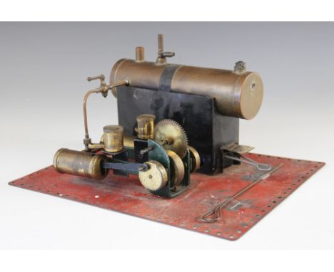 A live steam Mamod style twin cylinder stationary engine, 20th century, set to a Meccano type red base plate, each cylinder w