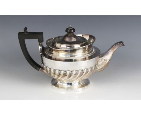 A Victorian three-piece silver tea service, Goldsmiths &amp; Silversmiths Co, London 1889, comprising teapot, sucrier and mil