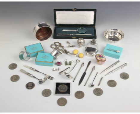 A selection of silver and silver coloured tableware and accessories, to include; a Tiffany silver floral brooch, 64mm long, a