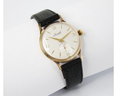 A gentleman's vintage 9ct gold Accurist wristwatch, the circular cream dial with Arabic and baton numerals, subsidiary second