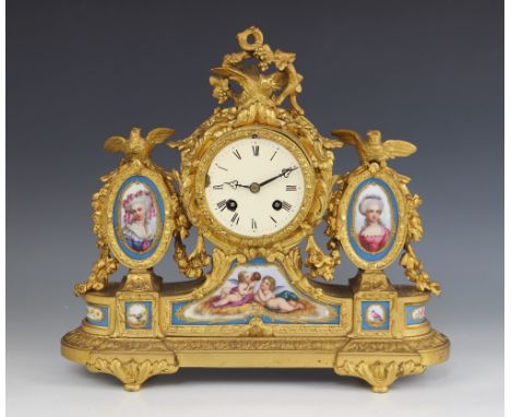 A French Louis XVI style gilt metal and porcelain mantel clock, late 19th century, the 8cm painted drum dial surmounted with 