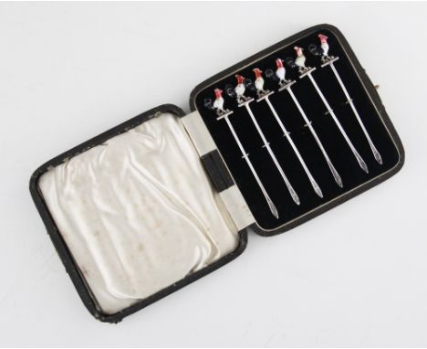 A George V set of six silver and enamel cocktail sticks, John Grinsell &amp; Sons, Birmingham 1933, each terminal modelled as